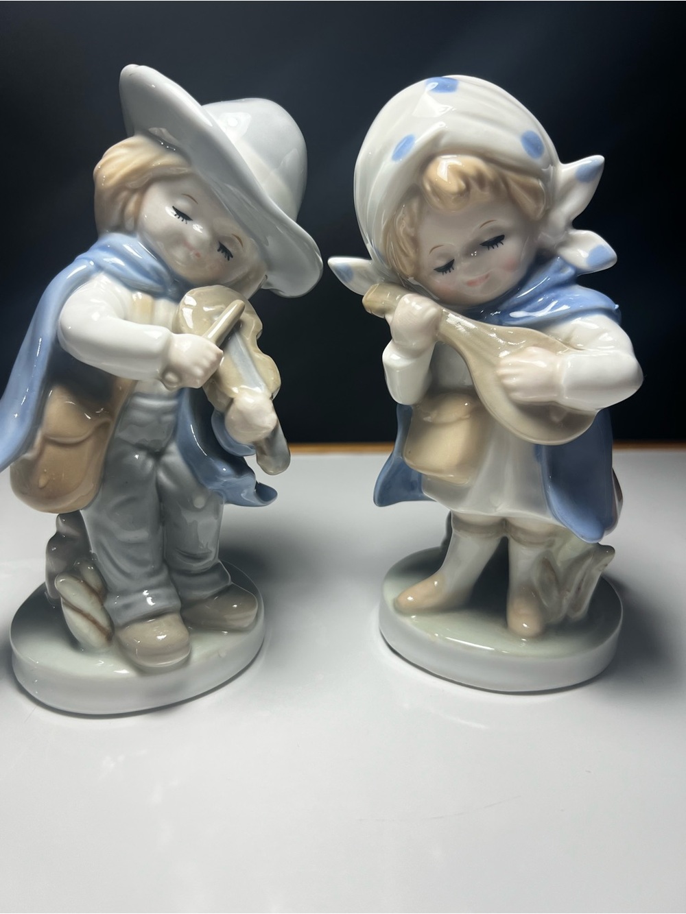 Source Unknown Blue and Cream Porcelain Musician Figurines